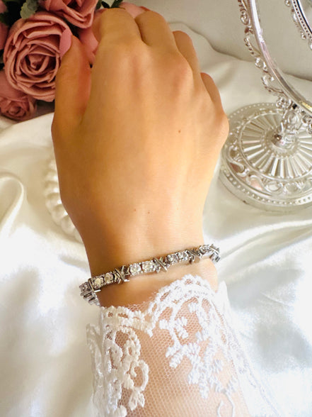 X tennis bracelet